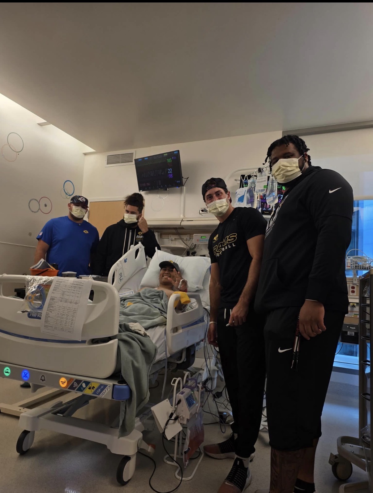 LA Rams players visiting Trenchkid in his hospital room