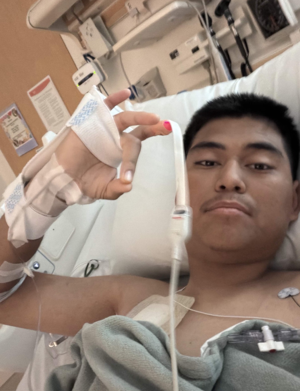 Trenchkid flexing his IV line after surgery