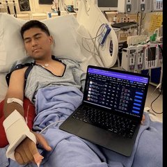 Trenchkid asleep in his hospital bed with the charts open